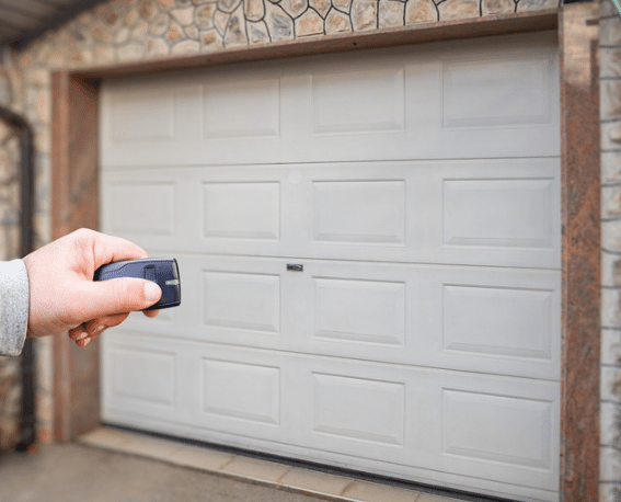 Opening a garage door using a remote.