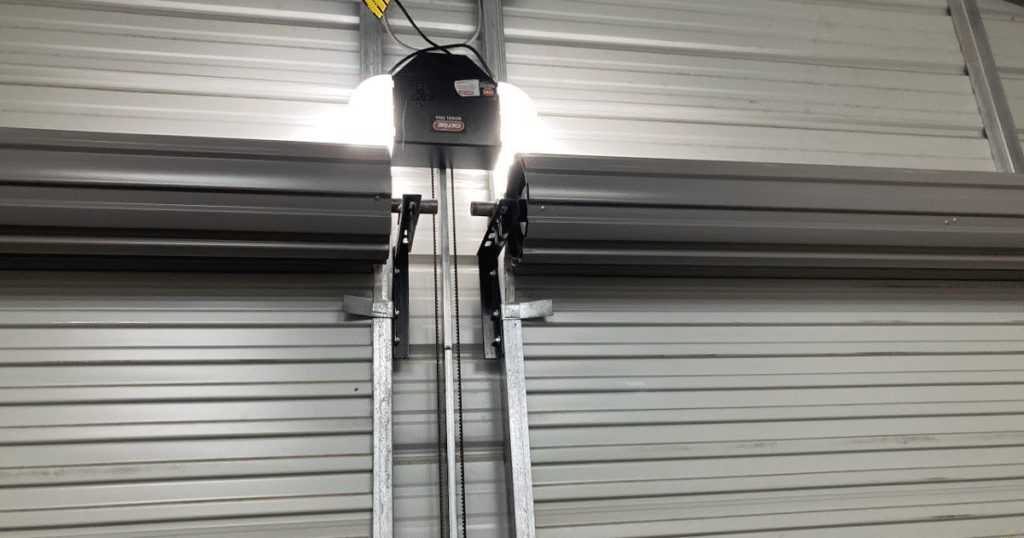 Industrial roll-up garage door opener system.